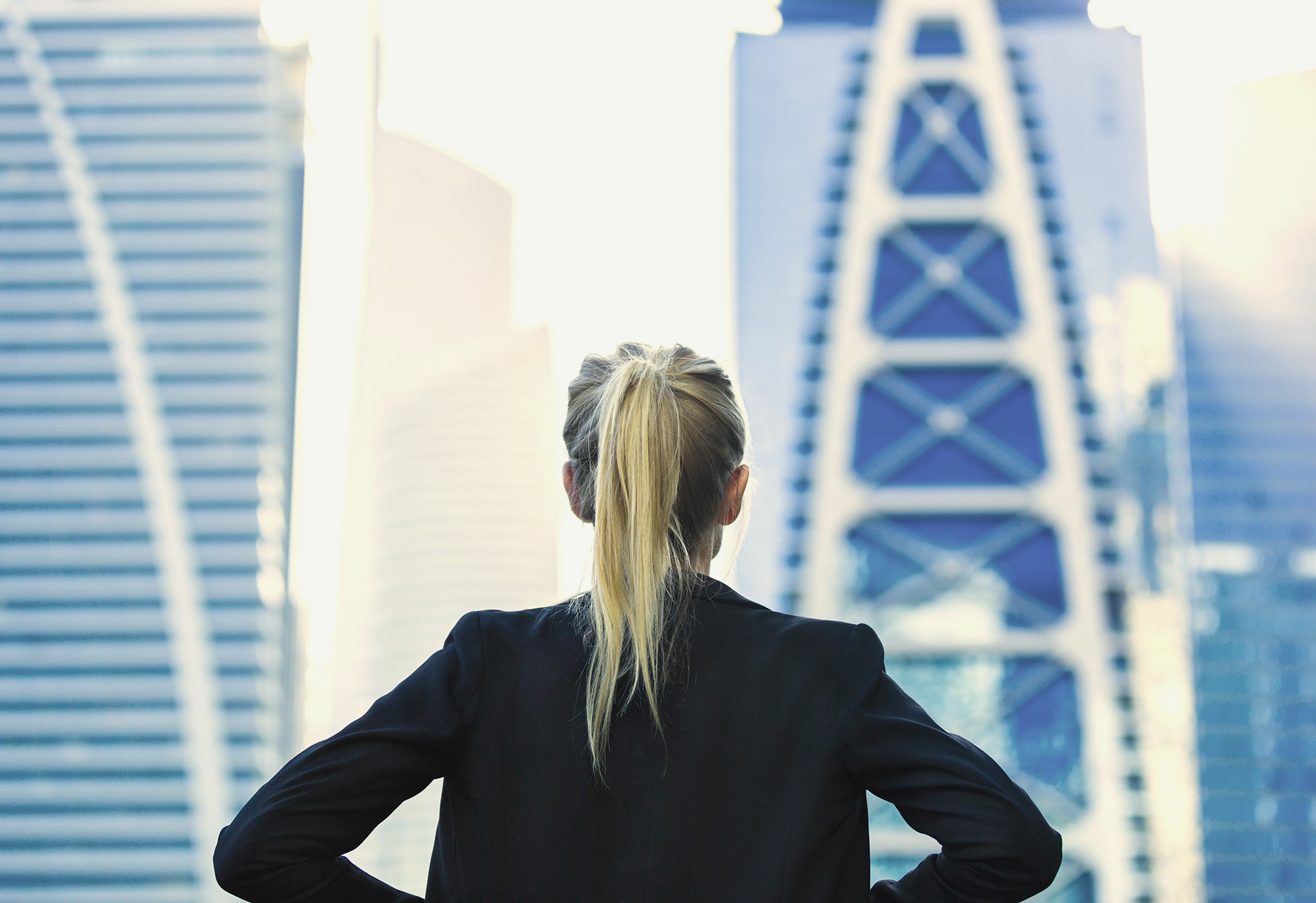 businesswoman overlooking the city center high-rises