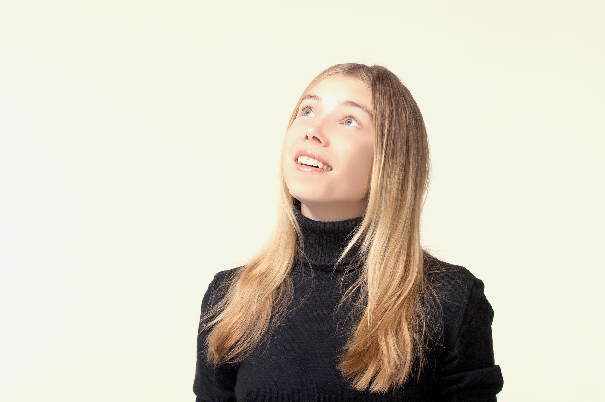 female looking up and thinking