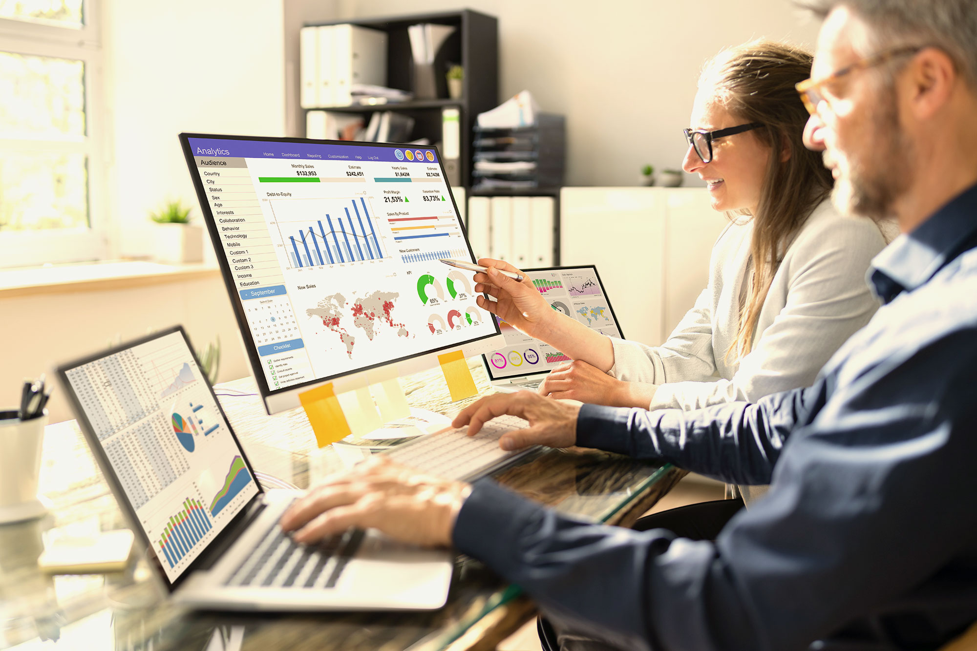 Two people looking at analytics.